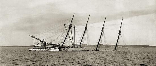 The schooner Alice E. Clark half-sunk on Coombs Ledge off Islesboro.