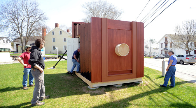 People check out the giant camera obsura constructed on at the Penobscot Marine Museum in Searsport.  When the camera is complete, several people will be able to go inside to experience how the image is projected inside real-life cameras.   Gabor Degre | BDN