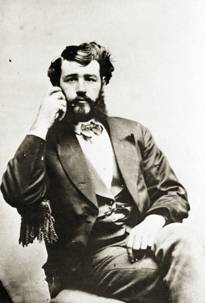 Black and white photograph of a man sitting